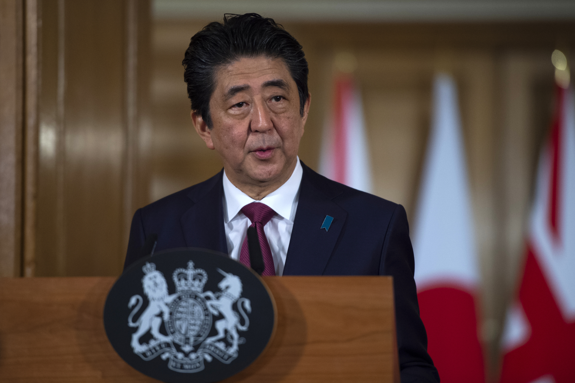 Prime Minister Shinzo Abe speaks during a joint news conference with British Prime Minister Theresa May in London on Thursday. | BLOOMBERG
