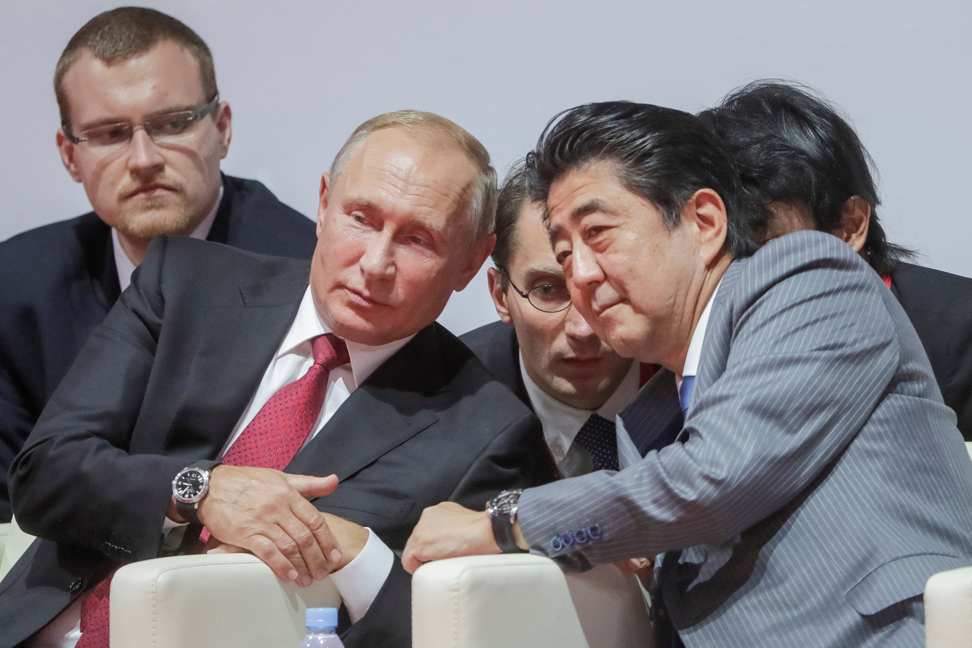 Russian President Vladimir Putin and Prime Minister Shinzo Abe watch an international judo tournament on the sidelines of the Eastern Economic Forum in Vladivostok, Russia, in September. The two are trying to lay the groundwork for reaching an agreement this year on a long-standing territorial dispute. | REUTERS