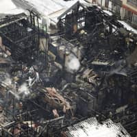 Houses that were burned down in an early morning fire Wednesday on Sado Island. | KYODO
