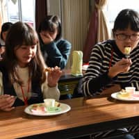 Students sample local farm products with the aim of creating their own dishes as part of a campaign to highlight recovery efforts in the prefecture of Fukushima and its capital, on Dec. 16.  | Fukushima Minpo