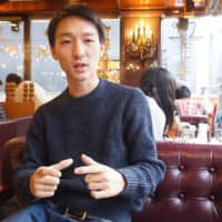 Takuya Yamase speaks Dec. 16 in Tokyo about his efforts in Cambodia to help impoverished villagers. | MAGDALENA OSUMI