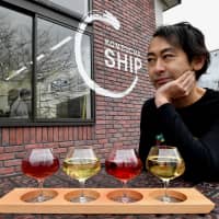 Kantaro Oizumi, president and CEO of Oizumi Kojo, sits outside his kombucha brewery. Captivated by the health drink, Oizumi decided to launch Japan’s first full-scale kombucha brewery in 2016 with the help of brewer Yuji Shimada. | YOSHIAKI MIURA