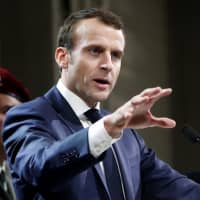 French President Emmanuel Macron speaks to military forces as part of his visit to the 11th Brigade of the Paratroopers of the Infantry at Toulouse-Francazal air base, near Toulouse, southern France, Jan. 17. | GUILLAUME HORCAJUELO / POOL PHOTO / VIA AP