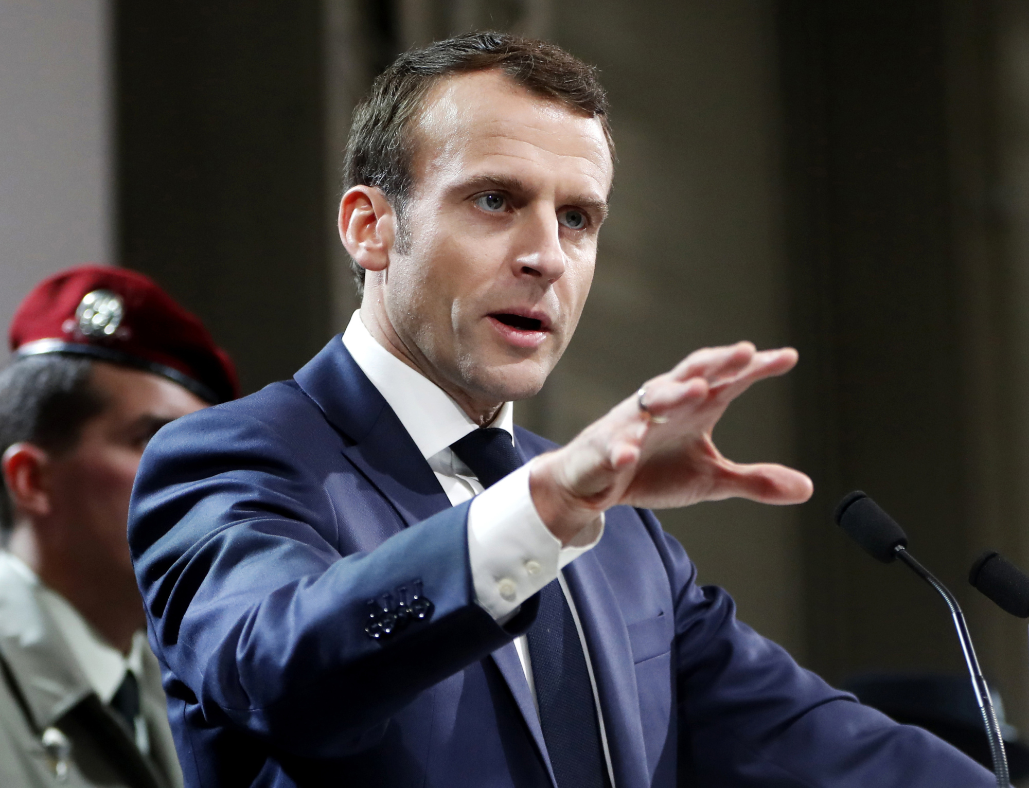 French President Emmanuel Macron speaks to military forces as part of his visit to the 11th Brigade of the Paratroopers of the Infantry at Toulouse-Francazal air base, near Toulouse, southern France, Jan. 17. | GUILLAUME HORCAJUELO / POOL PHOTO / VIA AP