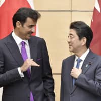 Qatari Emir Sheikh Tamim bin Hamad Al Thani talks to Prime Minister Shinzo Abe after their meeting in Tokyo on Tuesday. | KYODO