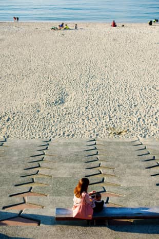 A mother and child await one of the legendary Seto Inland Sea sunsets at Futami Seaside Park in Futami, Ehime Prefecture, in 2014.