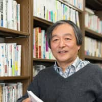 Chuo University sociology professor Masahiro Yamada poses for a photo in Hachioji in January. | ROBERT GILHOOLY
