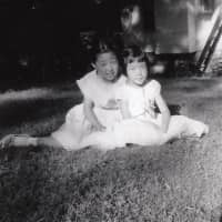 Family history: Author Eugenia Kim (right) with her sister, Sun, in the summer of 1958. | COURTESY OF EUGENIA KIM
