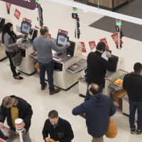 The self-checkout terminal, where customers ring up and bag their own purchases, is an increasingly common form of \"shadow work\" that companies impose on their customers. | BLOOMBERG