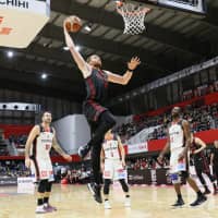 Alex Kirk of the Alvark Tokyo rises to deliver a slam dunk during his team\'s win over the Osaka Evessa on Sunday in Tachikawa. | B. LEAGUE
