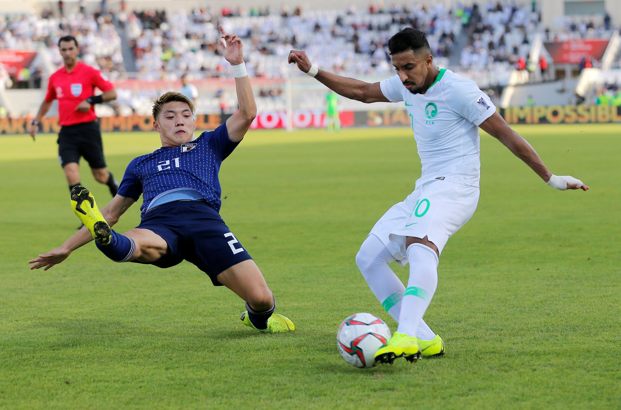 Attacking midfielder Ritsu Doan (left) spent much of Monday's win over Saudi Arabia playing defense, leaving him with just one goal thus far in the 2019 Asian Cup. | REUTERS