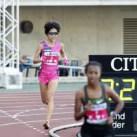 Rei Ohara approaches the finish line of the Osaka Women\'s Marathon behind eventual winner Fatuma Sado of Ethiopia on Sunday at Yanmar Stadium Nagai. | KYODO