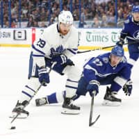 The Maple Leafs\' William Nylander skates with the puck as the Lightning\'s Ryan McDonagh in the third period on Thursday in Tampa, Florida. | KIM KLEMENT / USA TODAY / VIA REUTERS