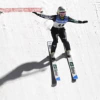 Sara Takanashi completes one of her two jumps in Friday\'s World Cup competition at the Zao resort in Yamagata. | KYODO