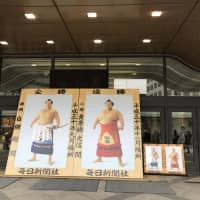 Portraits of yokozuna Hakuho (left) and sekiwake Takakeisho (depicted as a komusubi) are seen at Ryogoku Kokugikan. | JOHN GUNNING