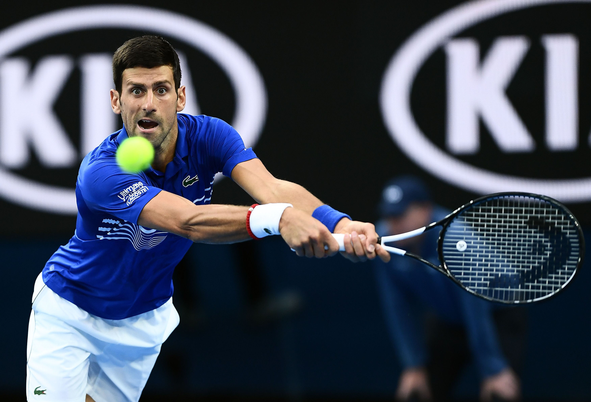 Novak Djokovic hits a return against Lucas Pouille during their semifinal match at the Australian Open on Friday. | AFP-JIJI