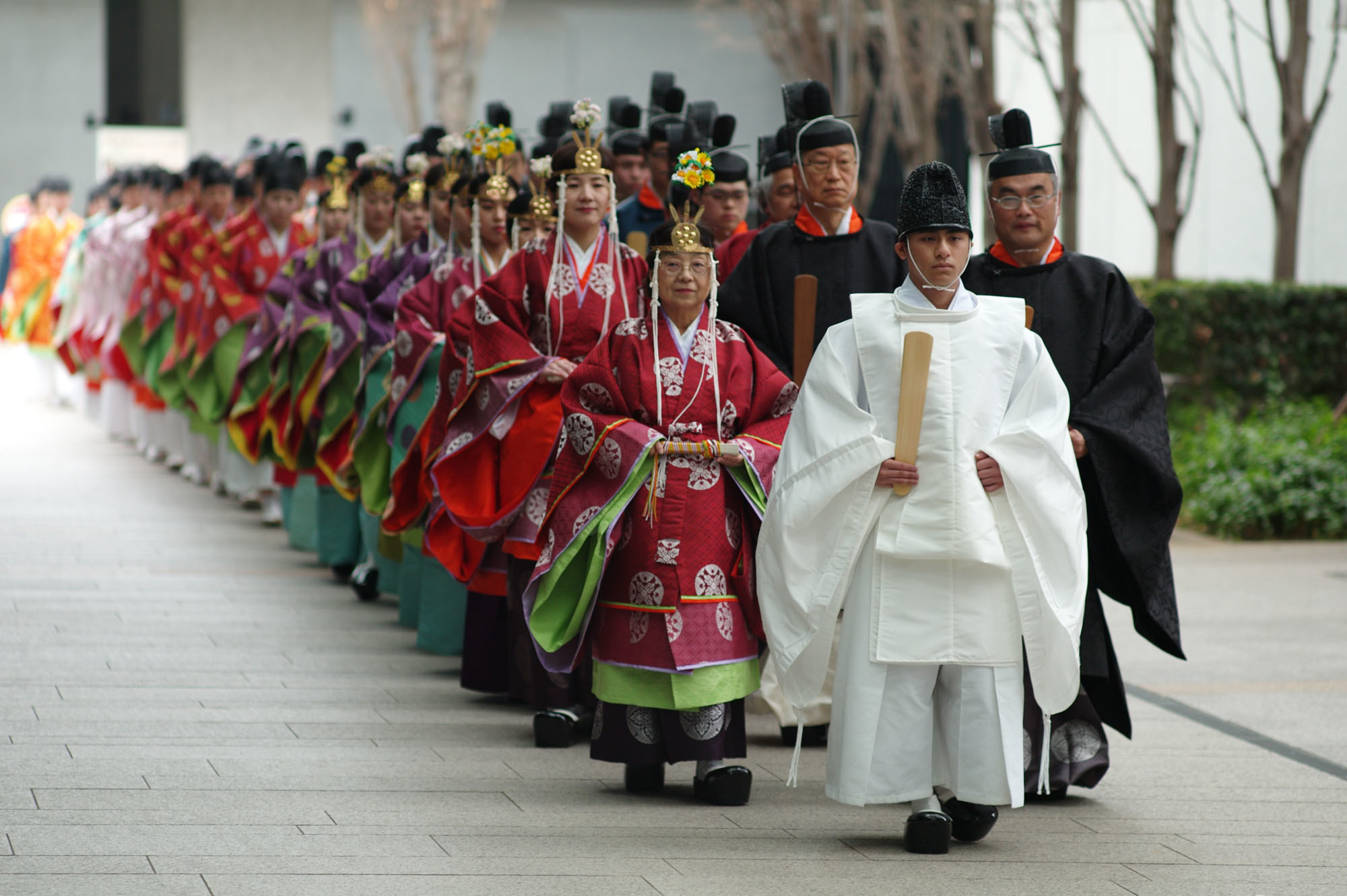 Fifty-four Kokugakuin University students wearing colorful traditional costumes take part in Seijin Kakanshiki, a Shinto ritual linked to nobility from the Nara Period (710-794). The event, for young adults who turned 20 during the current fiscal year, was organized by the university's Faculty of Shinto Studies in Tokyo's Shibuya Ward on Saturday, ahead of Monday's Coming-of-Age national holiday. | RYUSEI TAKAHASHI