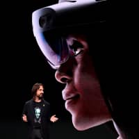 Microsoft technical fellow Alex Kipman speaks about the HoloLens 2 during a presentation at the Mobile World Congress (MWC) on the eve of the world\'s biggest mobile fair, in Barcelona, Spain, Sunday. | AFP-JIJI