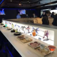 Robot Kichi, a bar that features robot figures and anime in Tokyo\'s Ikebukuro district, is shown to the media in a preview event on Tuesday. | KAZUAKI NAGATA