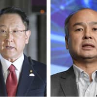 Toyota Motor Corp. President Akio Toyoda (left) and SoftBank Group Corp. CEO Masayoshi Son are leading joint efforts to launch a trial taxi ride-sharing service for business commuters. | KYODO