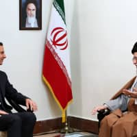 Iran\'s Supreme Leader Ayatollah Ali Khamenei gestures Monday in a meeting with Syrian President Bashar al-Assad in Tehran. | IRANIAN SUPREME LEADER\'S WEBSITE / SANA / VIA AFP-JIJI