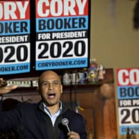 Senator Cory Booker, a Democrat from New Jersey and 2020 presidential candidate, speaks during a campaign event in Marshalltown, Iowa, on Saturday. Booker, in his Iowa debut as a Democratic presidential candidate, made an appeal to voters in rural and urban areas of the country as he called on his party to offer more solutions and less criticism of Republicans to win the White House in 2020. | BLOOMBERG