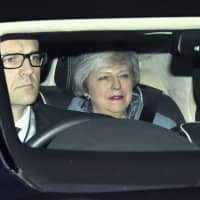 British Prime Minister Theresa May leaves the Houses of Parliament in Westminster following a Brexit vote in the House of Commons in London Thursday . May suffered an embarrassing defeat by lawmakers in a vote that left her bid to secure a European Union divorce deal stuck between an intransigent EU and a resistant U.K. Parliament &#8212; with Brexit just six weeks away. | DOMINIC LIPINSKI /PA / VIA AP