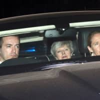 British Prime Minister Theresa May leaves the Houses of Parliament in London Wednesday. | REUTERS