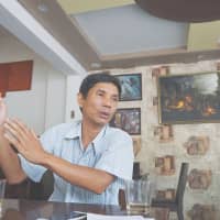 Thol Meng, the deputy head of the anti-trafficking police in Cambodia\'s southeastern Kompong Cham province, explains in an interview Tuesday how criminal gangs use locals to source women to be trafficked to China. | THOMSON REUTERS FOUNDATION/MATT