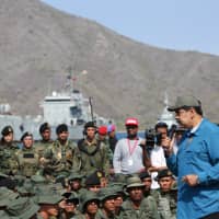 Venezuelan President Nicolas Maduro speaks to soldiers while he attends a military exercise in Turiamo, Venezuela, Sunday. | MIRAFLORES PALACE / HANDOUT / VIA REUTERS