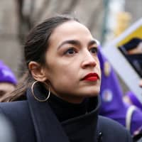 U.S. Rep. Alexandria Ocasio-Cortez looks on during a march organized by the Women\'s March Alliance in the Manhattan borough of New York on Jan. 19. | REUTERS