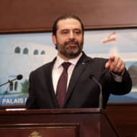 Lebanese Prime Minister Saad Hariri addresses the media after announcing the new Cabinet at the presidential palace in Baabda, east of Beirut, on Thursday. | AFP-JIJI