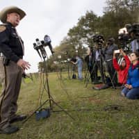 Chambers County Sheriff Brian Hawthorne gives an update on a plane crash in Trinity Bay during a news conference in Anahuac, Texas, Saturday. A Boeing 767 cargo jetliner heading to Houston with a few people aboard disintegrated after crashing Saturday into the bay east of the city. | BRETT COOMER / HOUSTON CHRONICLE / VIA AP