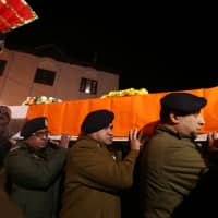 Indian police carry the coffin containing of their fallen colleague, who according to police was killed in a gun battle between suspected militants and security forces in south Kashmir\'s Kulgam district, during his wreath laying ceremony in Srinagar, India, Sunday. | REUTERS
