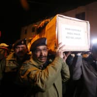 Indian police carry the coffin containing the body of their fallen colleague, who according to police was killed in a gunbattle between suspected militants and security forces in south Kashmir\'s Pulwama district, during his wreath-laying ceremony in Srinagar, India, Monday. | REUTERS