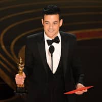 Best actor winner for \"Bohemian Rhapsody\" Rami Malek accepts his award during the 91st Annual Academy Awards at the Dolby Theatre in Hollywood, California, on Sunday. | AFP-JIJI