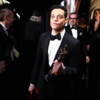 Best actor winner for \"Bohemian Rhapsody\" Rami Malek walks backstage during the 91st Annual Academy Awards at the Dolby Theatre in Hollywood, California, on Sunday. | AFP-JIJI