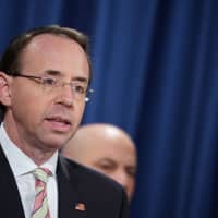 U..S Deputy Attorney General Rod Rosenstein speaks during a press conference announcing efforts against computer hacking and extortion at the Department of Justice in Washington last November. | AFP-JIJI