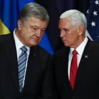 U.S. Vice President Mike Pence (right) talks with Ukrainian President Petro Poroshenko during a bilateral meeting at the Munich Security Conference in Munich, Germany, Saturday. | AP