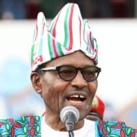 Nigerian President Muhammadu Buhari addresses supporters during a campaign rally ahead of the country\'s presidential election, in Lagos Feb. 9. | REUTERS