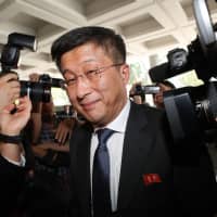 North Korea\'s top nuclear negotiator, Kim Hyok Chol, is surrounded by the media as he arrives for talks with U.S. counterpart Stephen Biegun in Hanoi on Thursday. | AFP-JIJI