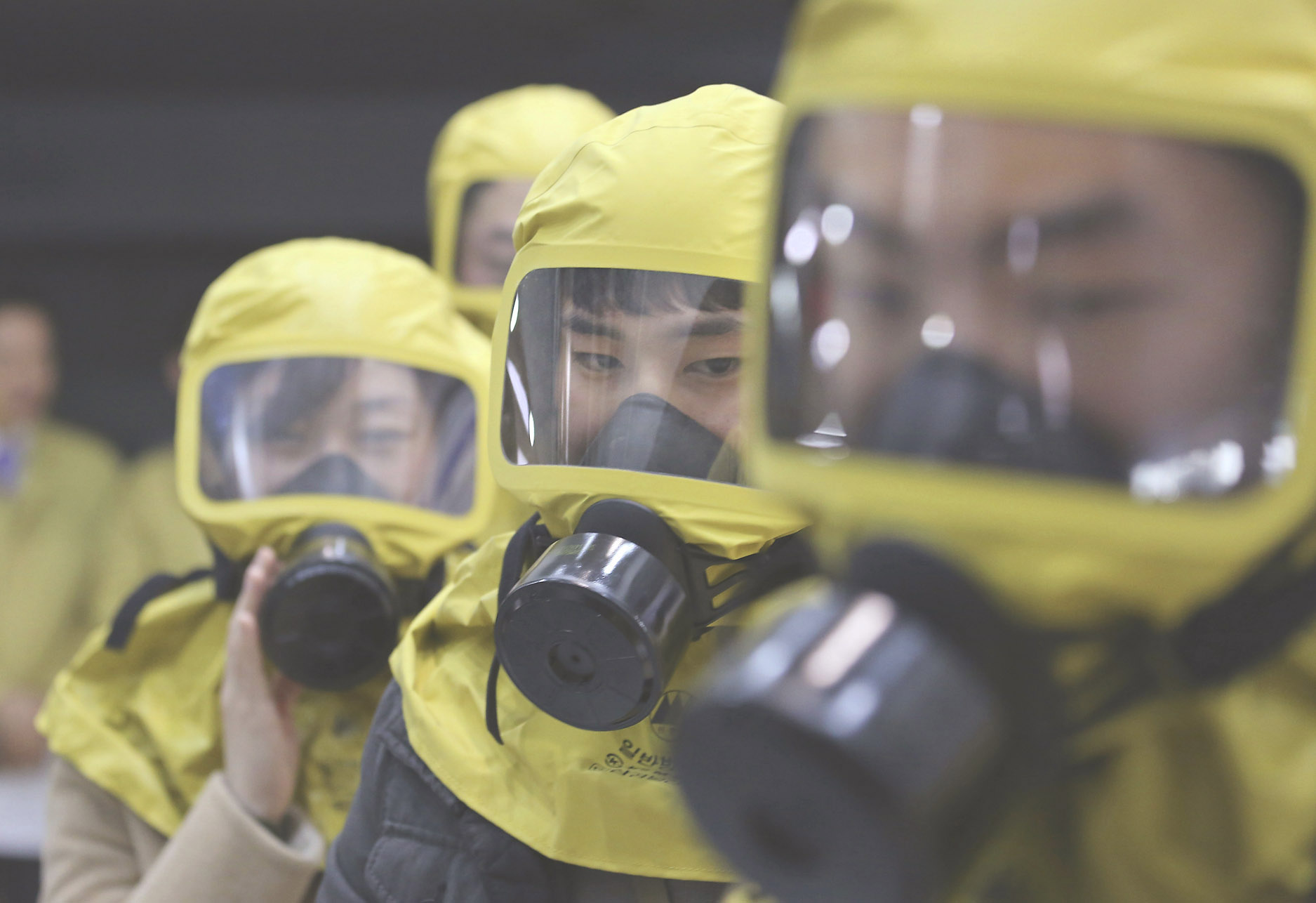 South Korean government officials attend a civil defense drill against a possible North Korean chemical attack in Seoul in March 2017. | AP