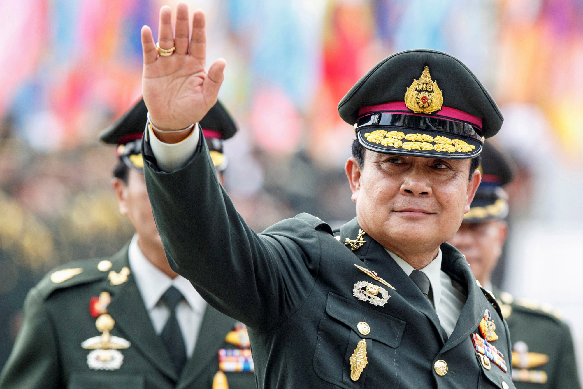 Thai Prime Minister Prayuth Chan-ocha waves after a handover ceremony for the new Royal Thai Army Chief at the Thai Army Headquarters in Bangkok in September 2014. | REUTERS