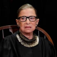 U.S. Supreme Court Associate Justice Ruth Bader Ginsburg is seen during a group portrait session for the new full court at the Supreme Court in Washington in Novembe. | REUTERS