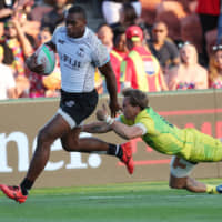Mesulame Kunavula of Fiji runs away for a try during a World Rugby Sevens Series match with Australia at Waikato Stadium in Hamilton, New Zealand, on Jan. 26. Australia is hoping to use the rugby league variant of the game to expand its soft power in the region. | AFP-JIJI