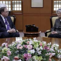 South Korean Foreign Minister Kang Kyung-wha and Timothy Betts, acting deputy assistant secretary and senior advisor for Security Negotiations and Agreements with the U.S. Department of State, talk on Sunday during their meeting at the Foreign Ministry in Seoul to discuss South Korea\'s contribution toward the upkeep of U.S. troops in the country. | AP