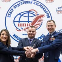 Members of the International Space Station expedition 59/60 (from left) NASA astronauts Christina Hammock Koch and Nick Hague and Russian cosmonaut Alexey Ovchinin pose during a press conference at the Gagarin Cosmonauts\' Training Centre in Star City outside Moscow on Thursday. The trio are preparing for the launch onboard the Soyuz MS-12 spacecraft from the Russian-leased Kazakh Baikonur cosmodrome on March 14. | AFP-JIJI