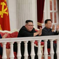 North Korean leader Kim Jong Un and wife Ri Sol Ju applaud during a performance by the State Merited Chorus at an annex to the headquarters of the Party Central Committee on the 71st founding anniversary of the Korean People\'s Army (KPA), in Pyongyang Feb. 8. | KCNA / VIA REUTERS