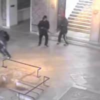 Closed-circuit television footage released by the Tunisian interior ministry shows the two gunmen (right) who attacked Tunisia\'s National Bardo Museum holding guns as a man runs out of the museum on March 18, 2015. | AFP-JIJI