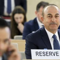 Turkish Foreign Minister Mevlut Cavusoglu attends the High-Level Segment of the 40th session of the Human Rights Council, at the European headquarters of the United Nations in Geneva on Monday. | SALVATORE DI NOLFI / KEYSTONE / VIA AP